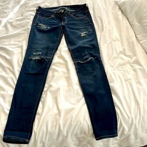 Dark wash distressed American Eagle jeggings. Size 6 extra long